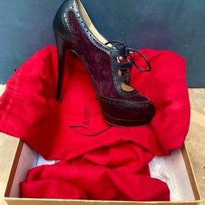 SOLD Christian Louboutin black and wine calf tie up pumps. Size 36.5.